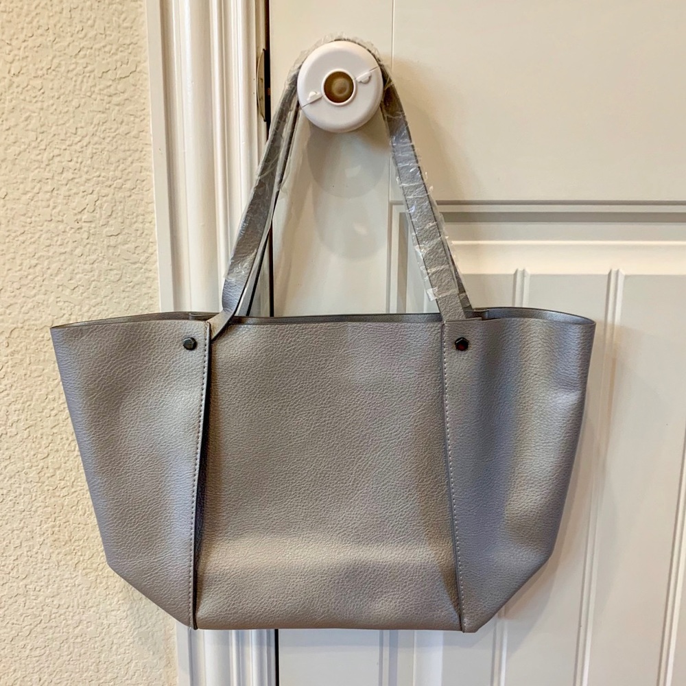 Silver over-the-shoulder tote bag.